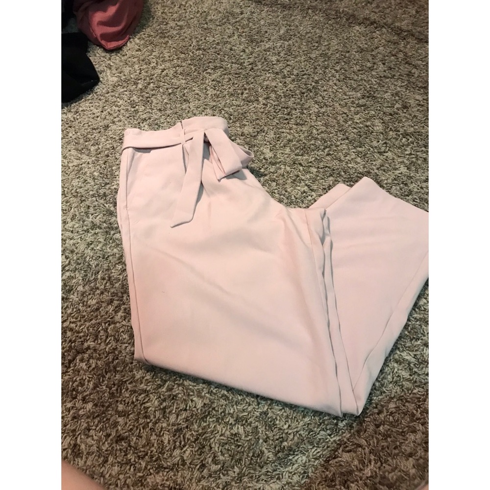 Mid-rise pink paper bag pants.